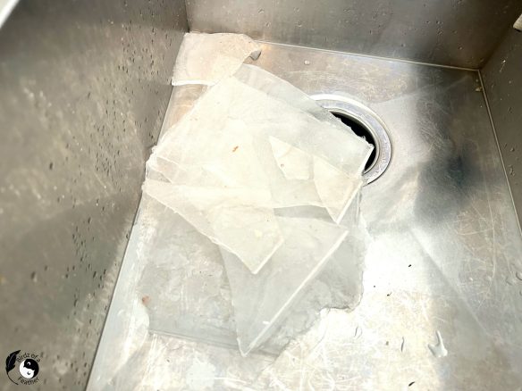 chunks of ice in sink; a symptom of water leak from fridge