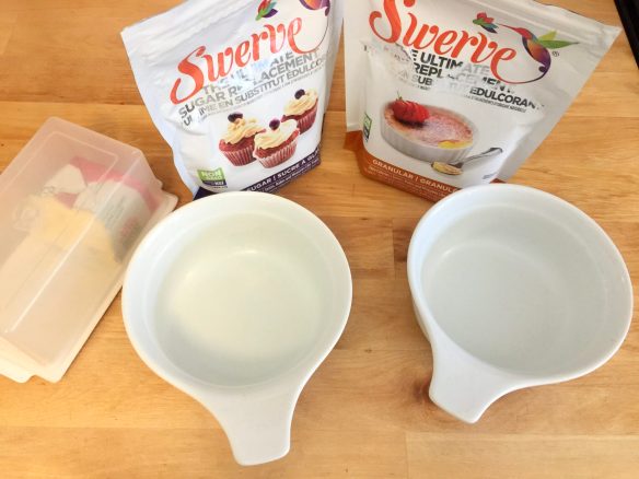 Baking dishes, swerve and butter on a counter