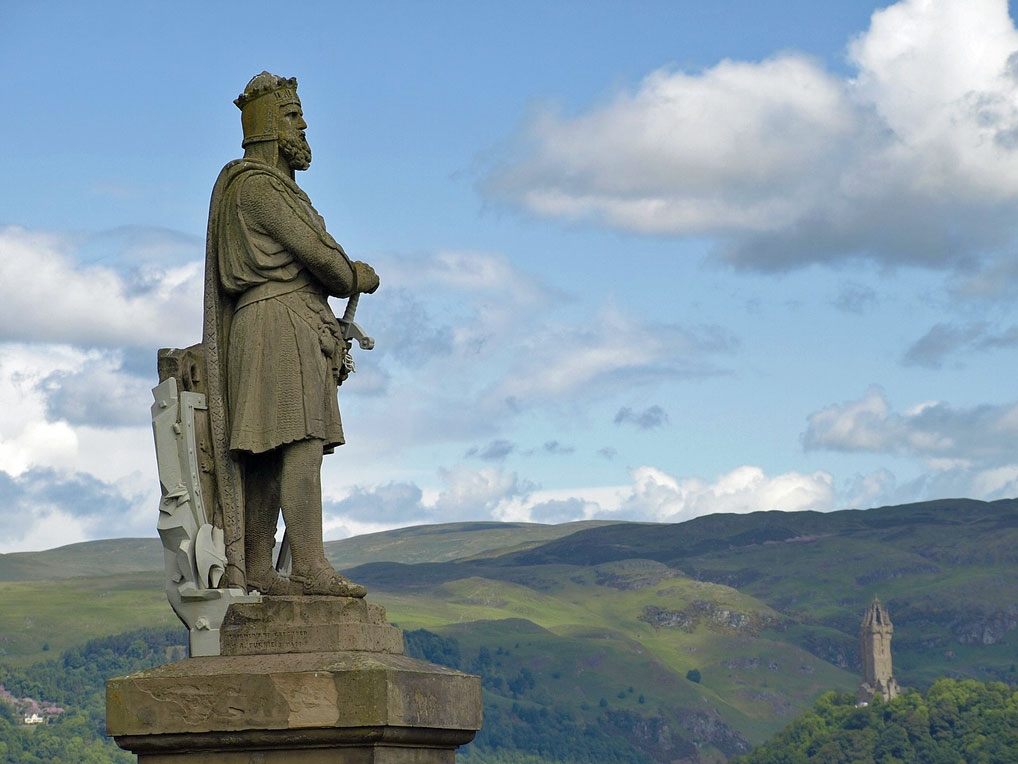 Statue of Robert the Bruce at Stirling Castle. In the background is the National Wallace Monument. Statue, Robert the Bruce, Stirling, Scottish independence