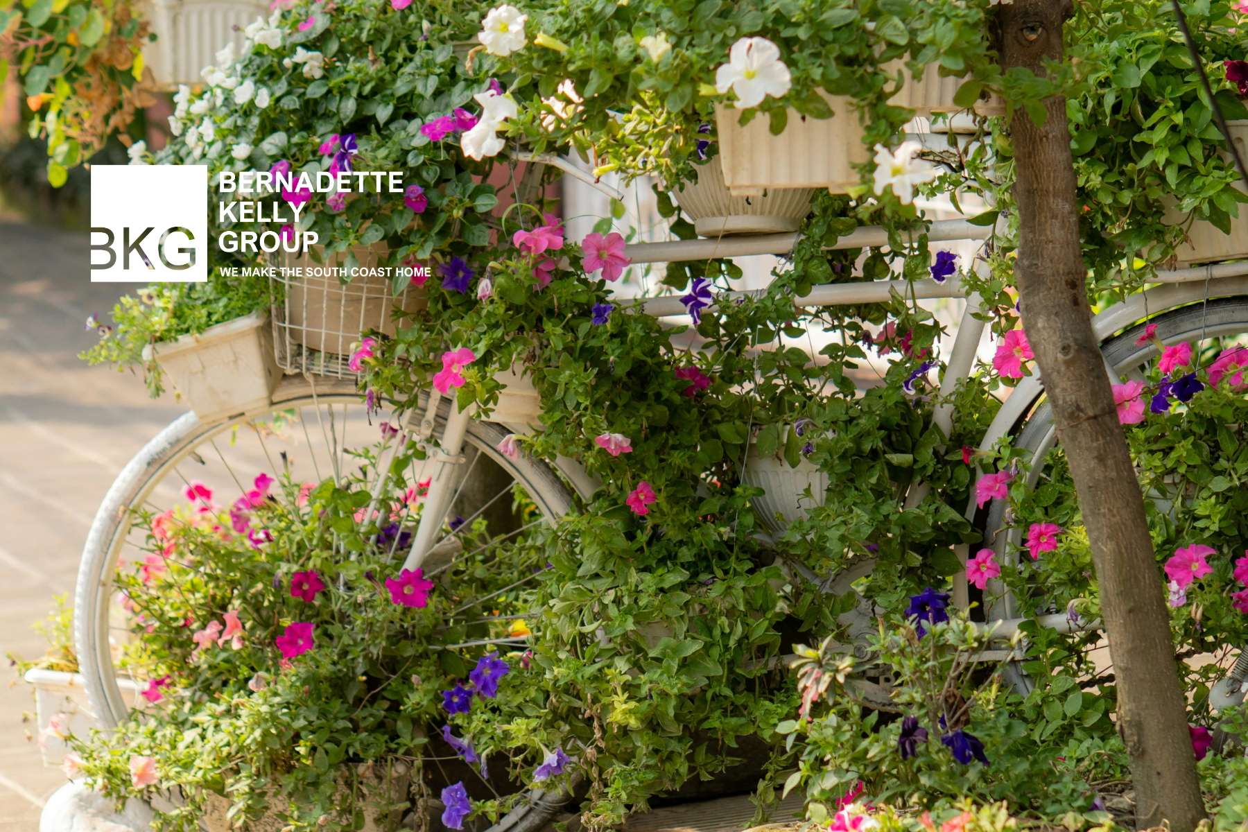 KEEPING YOUR COASTAL CURB APPEAL BLOOMING: A GUIDE TO SPRING PLANTERS