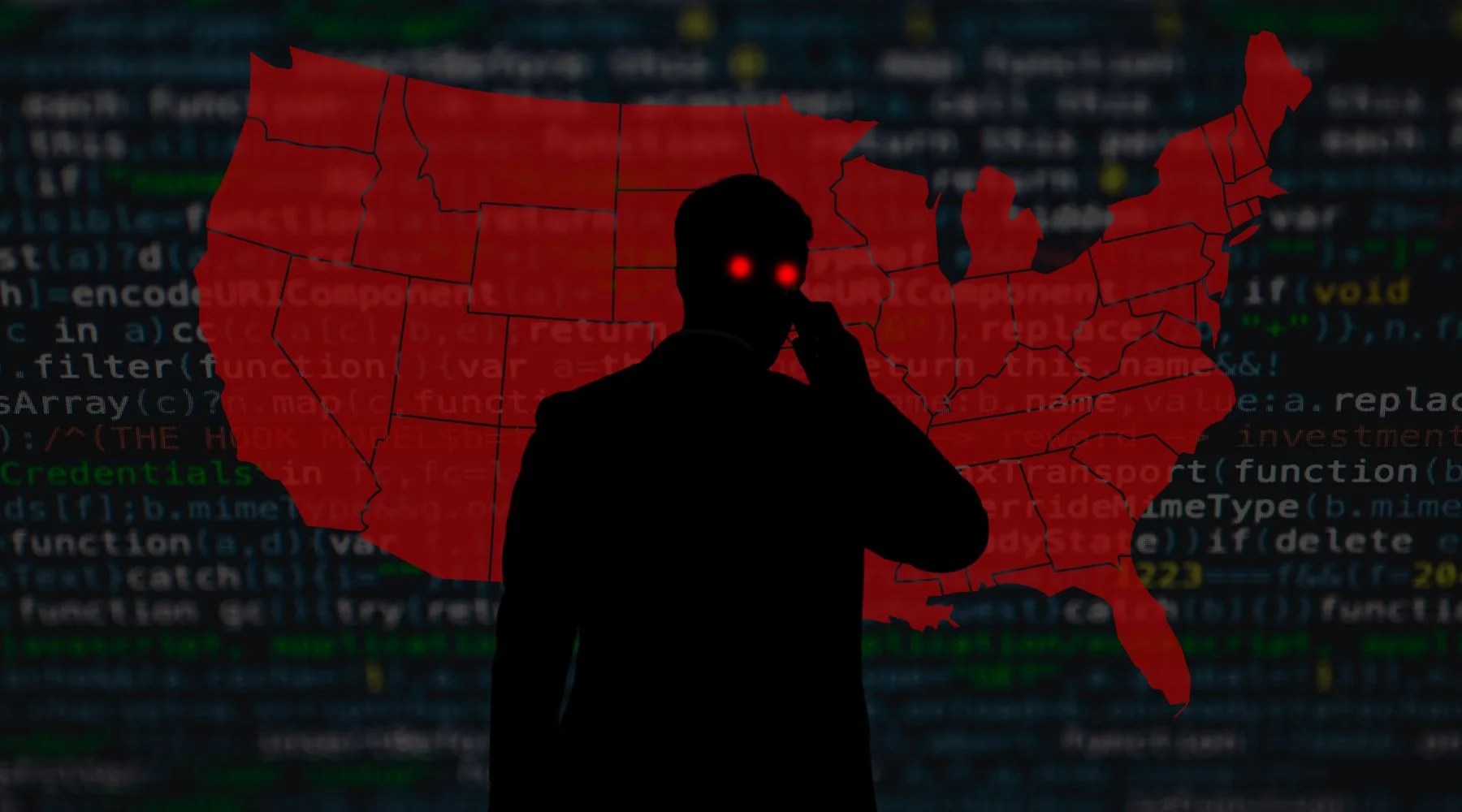 Silhouetted figure with glowing red eyes stands before a red map of the United States and a dark background filled with lines of computer programming code.