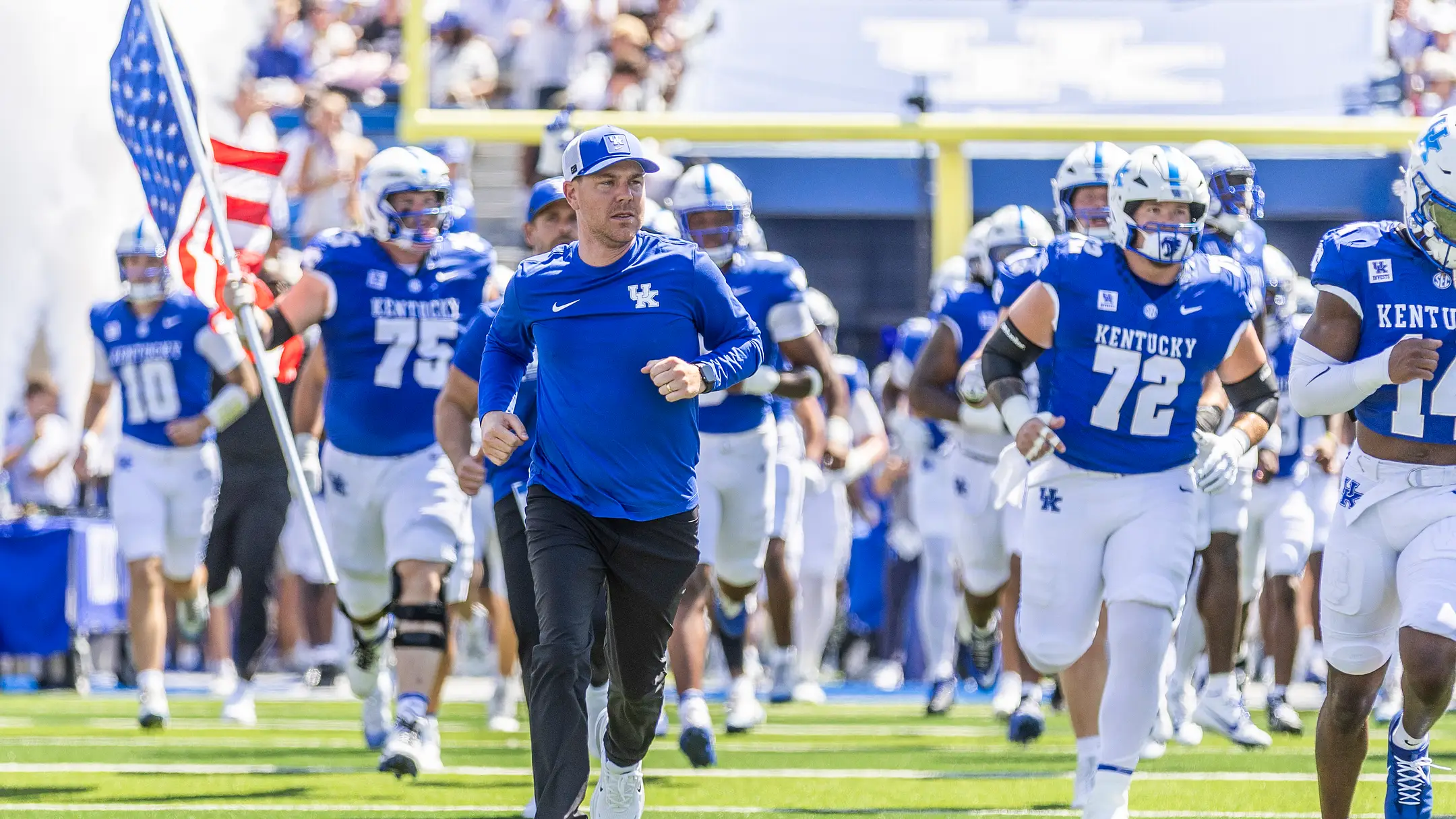 Sep 5, 2026; Lexington, Kentucky, USA; Kentucky Wildcats head coach Will Stein runs onto the field before the game against the Youngstown State Penguins at Kroger Field. Mandatory Credit: Arden Barnes-Imagn Images | IMAGN IMAGES via Reuters Connect