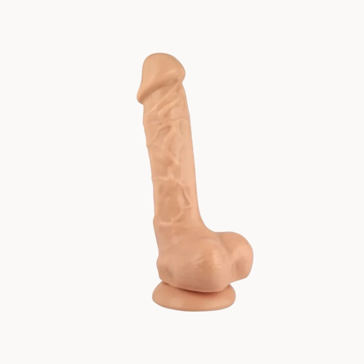 Alabaster Silk dildo on a light grey background.