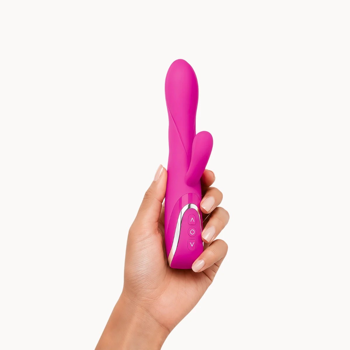 Hand showcasing ClitMax™ vibrator against a light grey background.