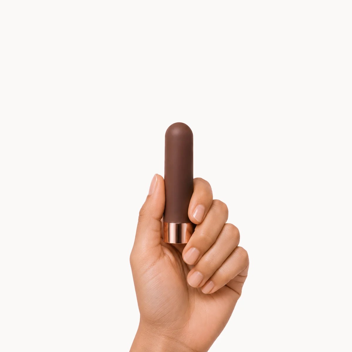 Hand showcasing Duet Vibe vibrator against a light grey background.