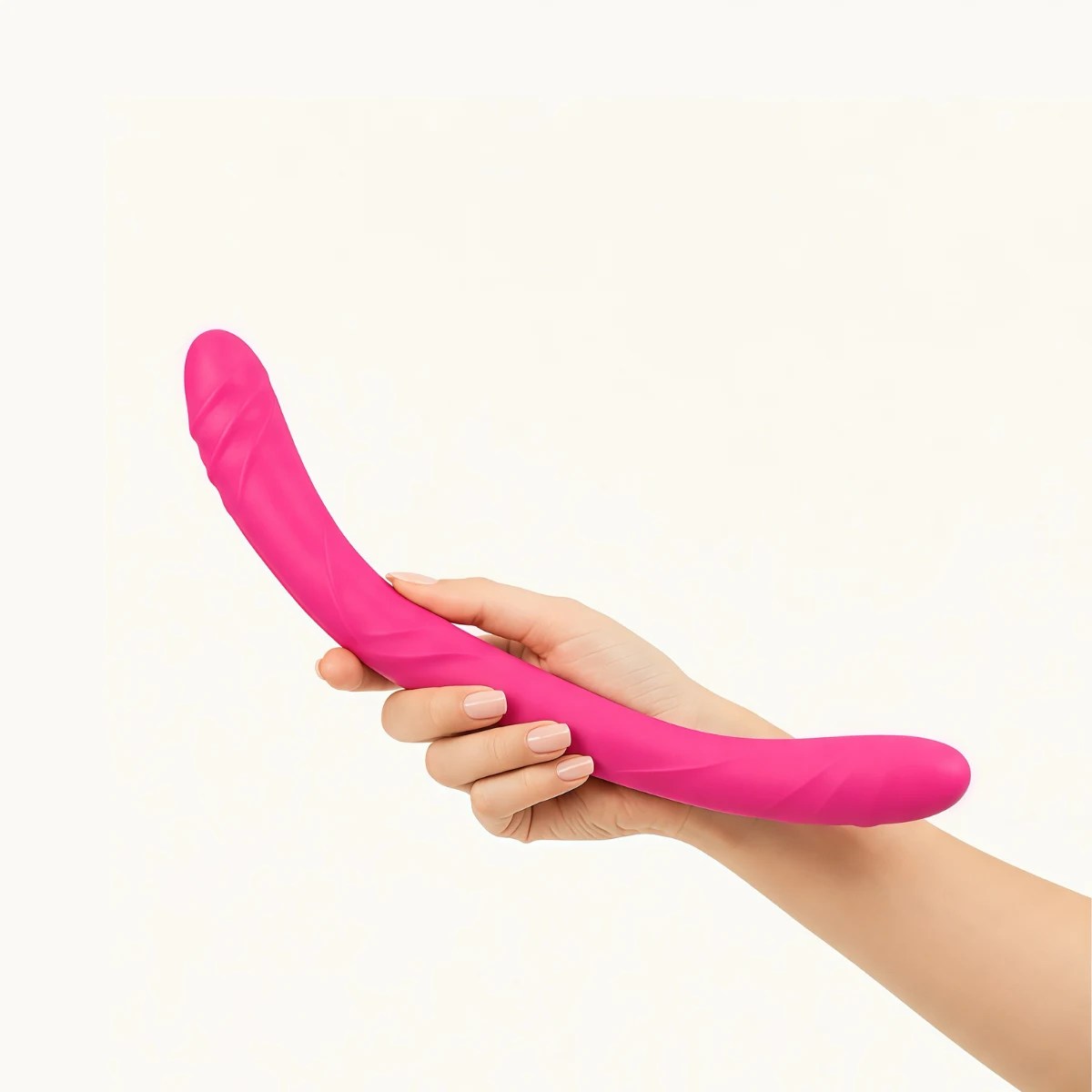 Hand showcasing FlexLuxe Duo™ dildo against a light grey background.
