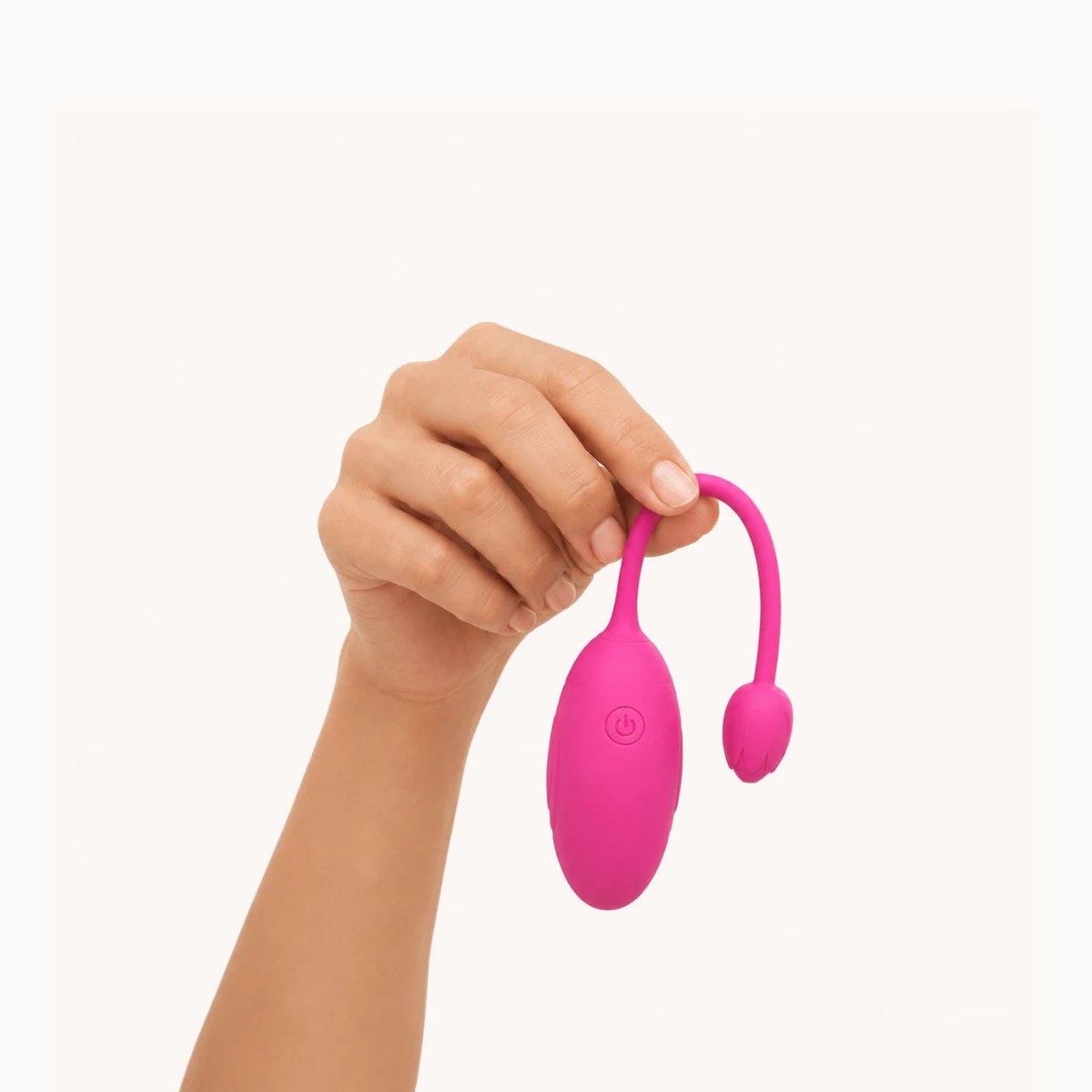 Hand showcasing Lover Link vibrator against a light grey background.