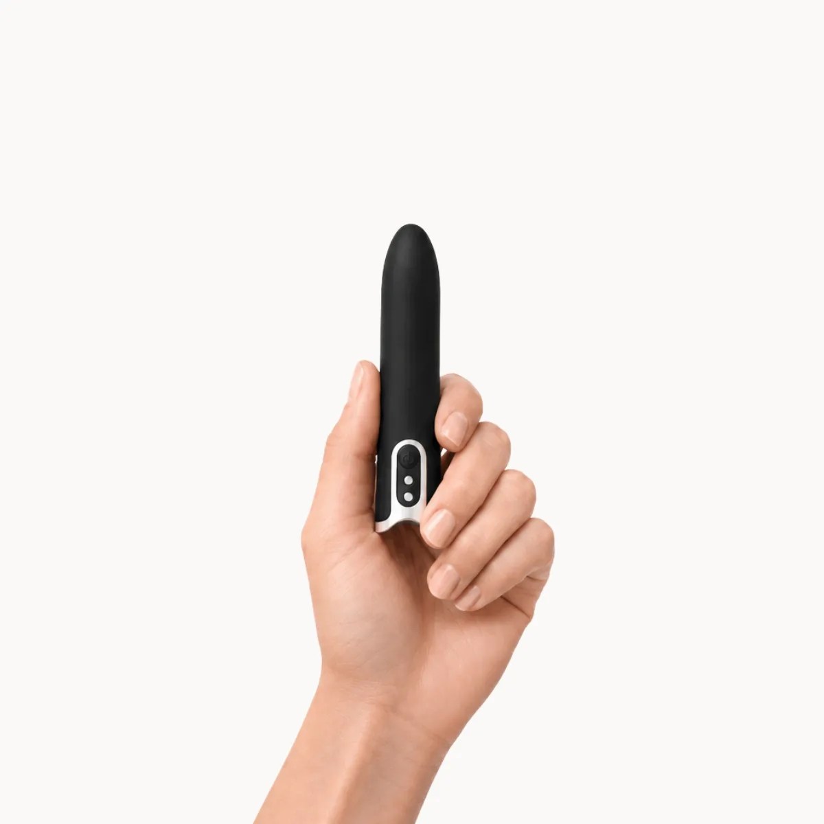Hand showcasing Lumi vibrator against a light grey background.