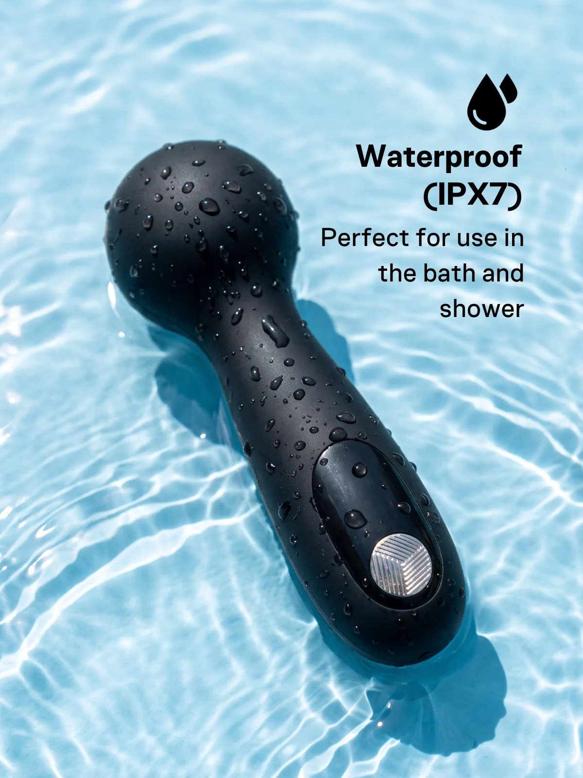 Luna Tap IPX7 waterproof mini wand vibrator with a black silicone body and metallic control button, covered in water droplets.