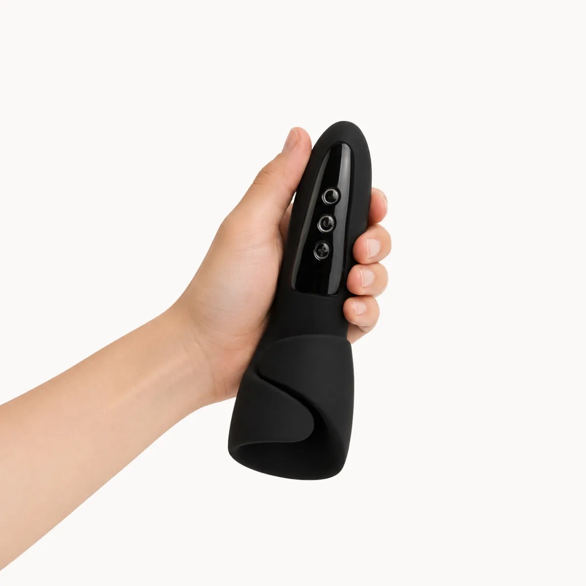 Hand showcasing Novus male masturbator against a light grey background.