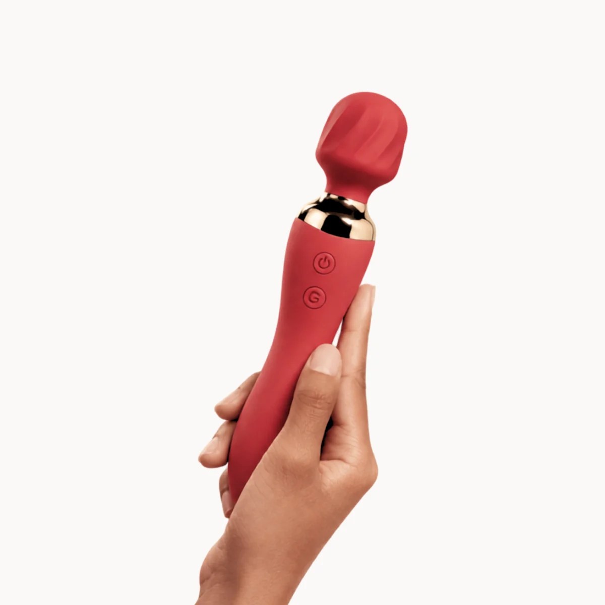 Hand showcasing ThermaLuxe™ vibrator against a light grey background.