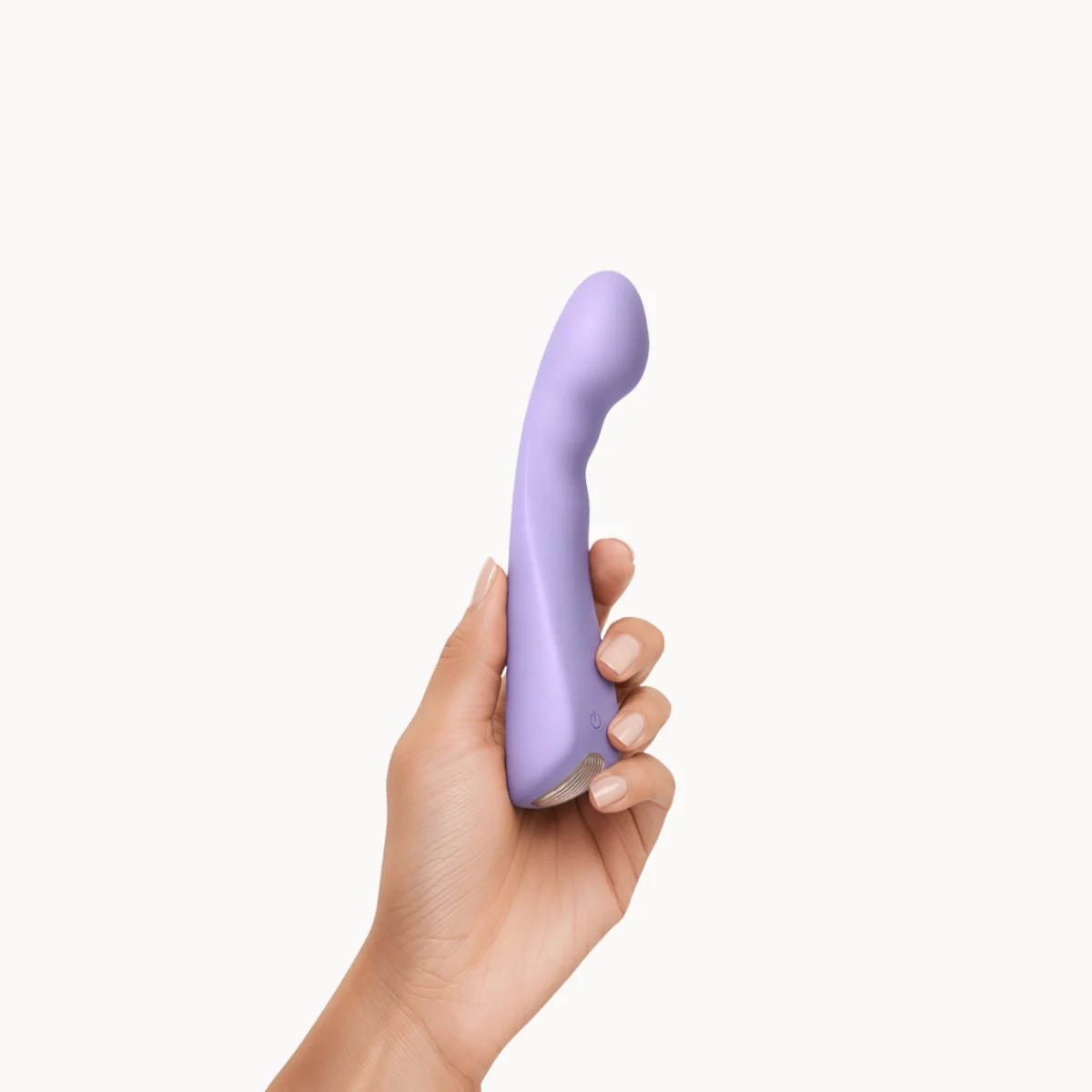 Hand showcasing Vesper vibrator against a light grey background.