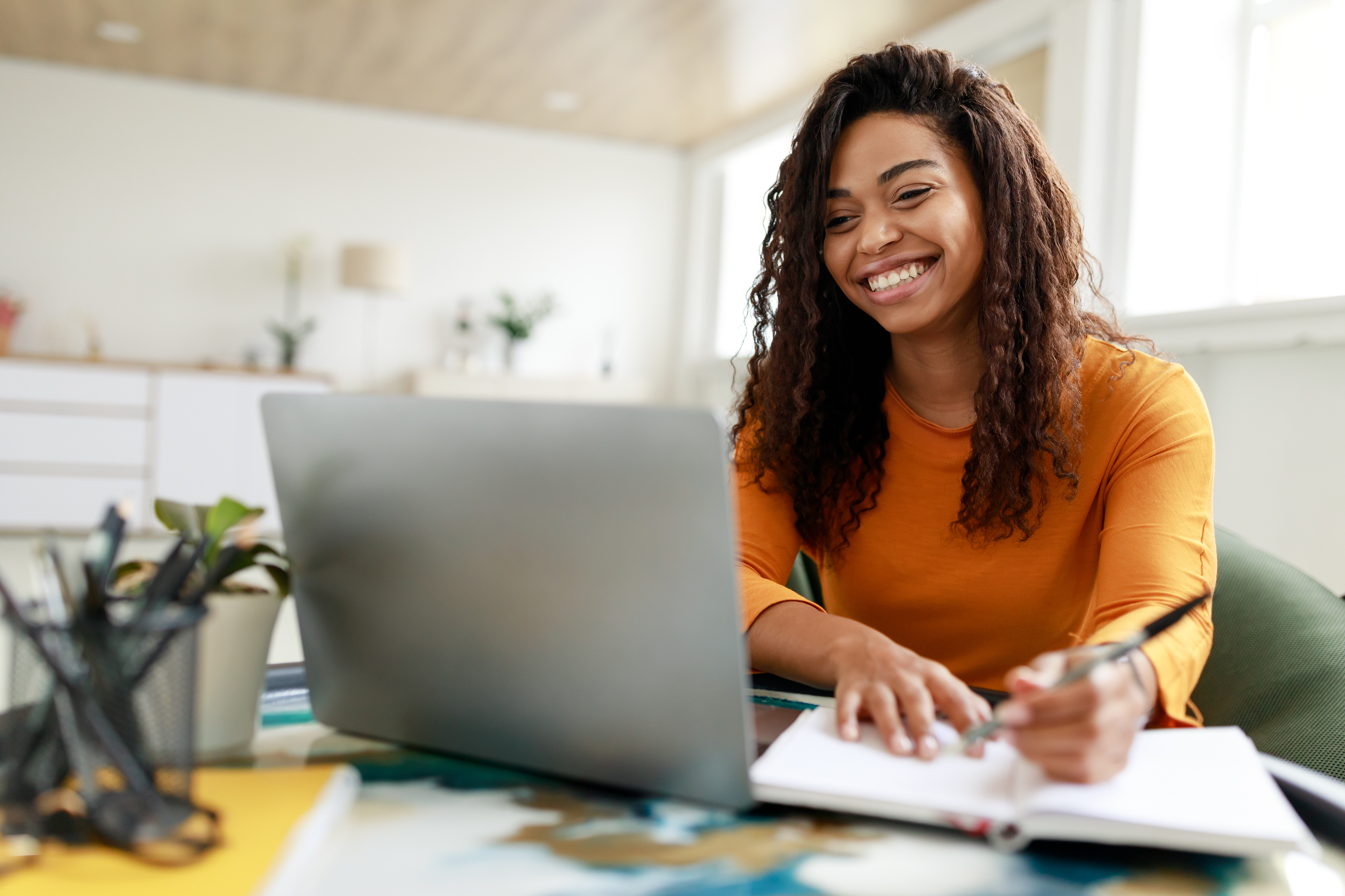 African-American woman looking at computer
