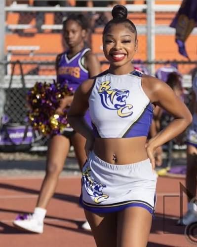 Young African-American Woman in cheer uniform