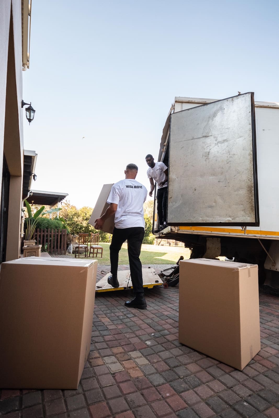 Movers Loading Boxes onto Truck