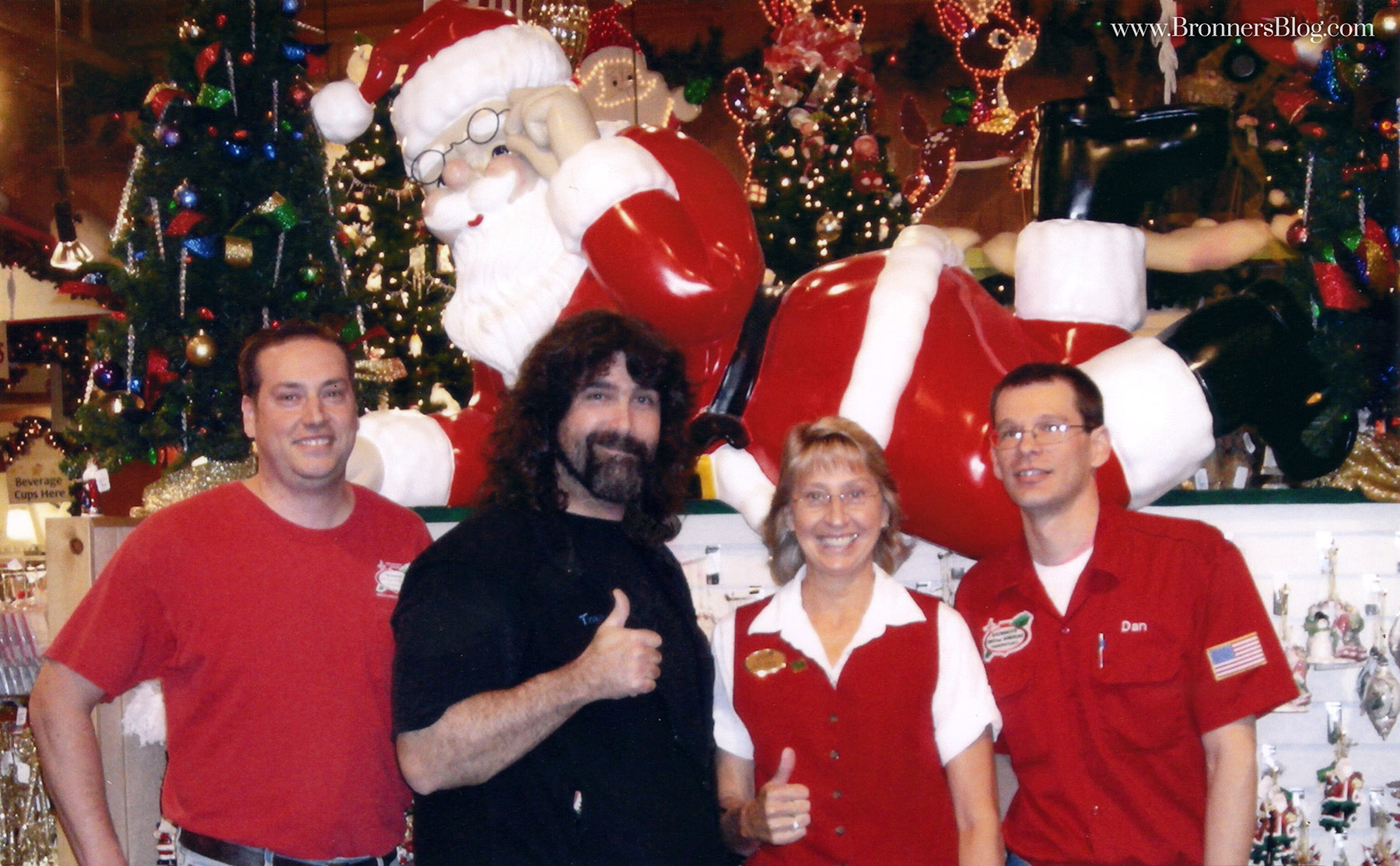 Former WWE wrestler "Mankind", Mick Foley, poses for a photo with Bronner's staff and fans.