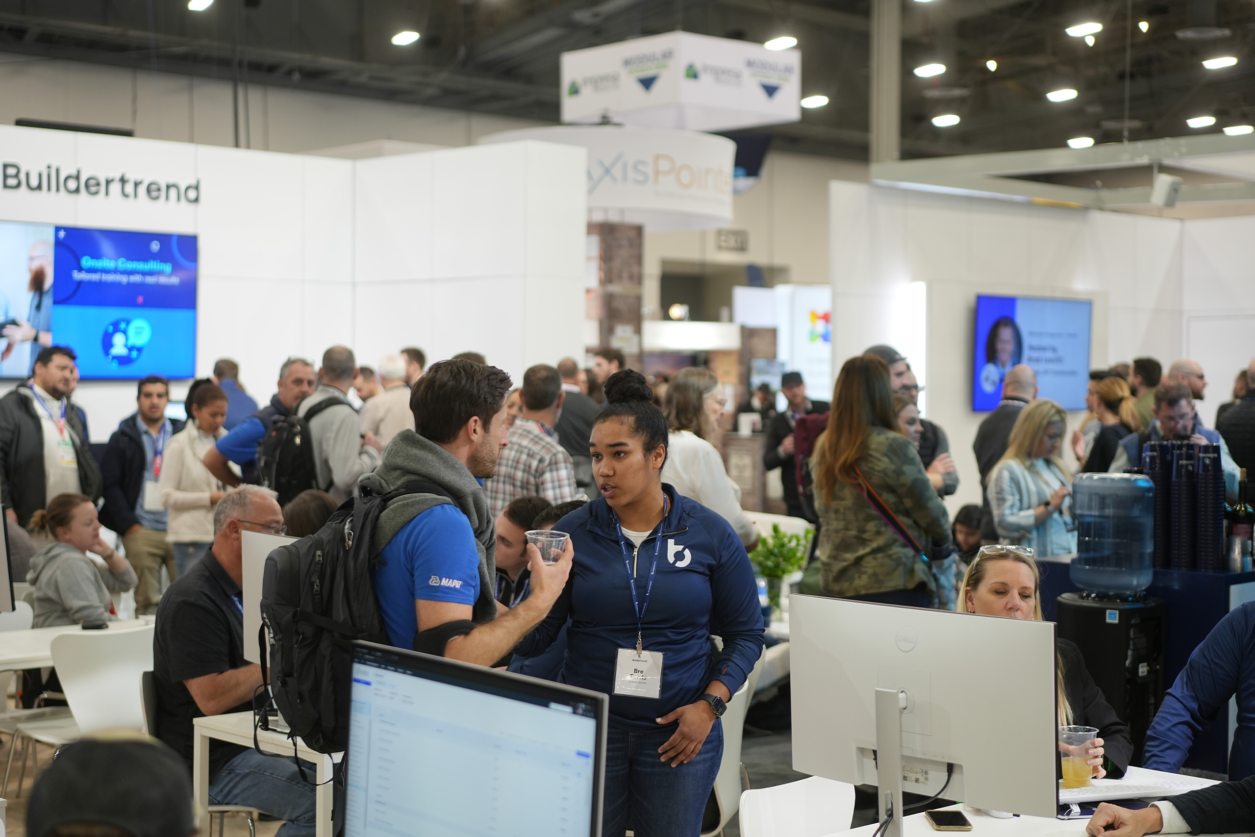 Exhibitors and attendees discuss products at IBS