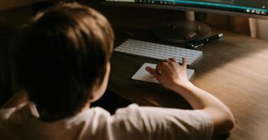 person using computer on table