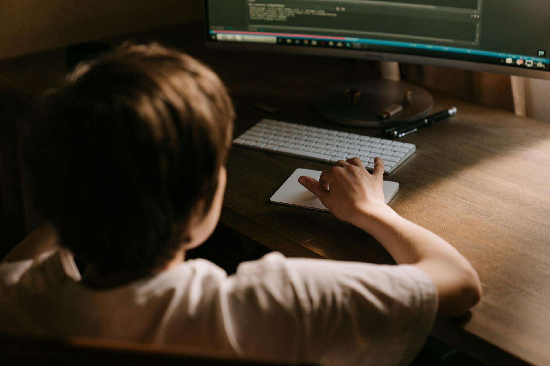 person using computer on table