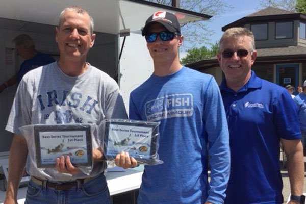 Matt and Steve Wheeler hold their plaques