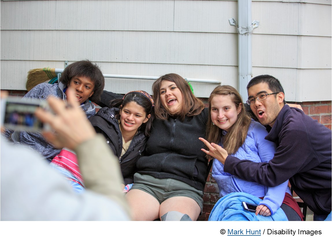 Photo of people enjoying community. mixed group of young people many different abilities, ethnicities.