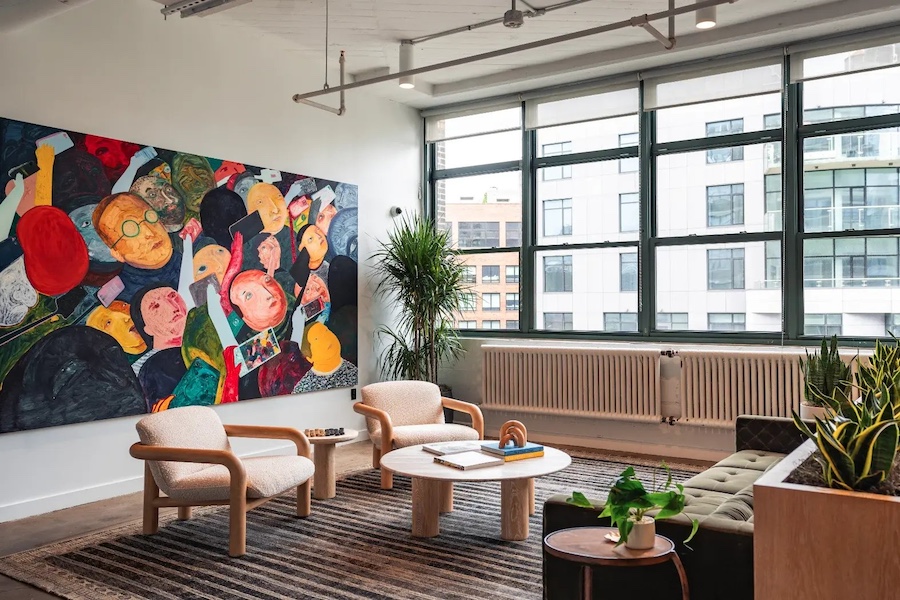 Bright, modern office space at The SQ, 205 Hudson Street, featuring high ceilings, large windows with Hudson River views, and contemporary furnishings.