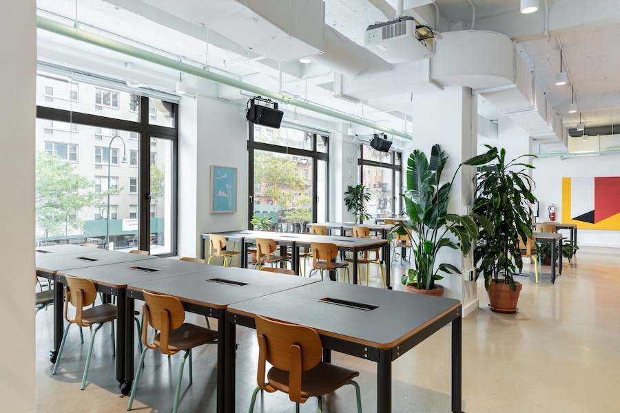 Collaborative coworking space at WeWork 154 W 14th Street, Chelsea, with private offices, open lounges, and bookable meeting rooms.