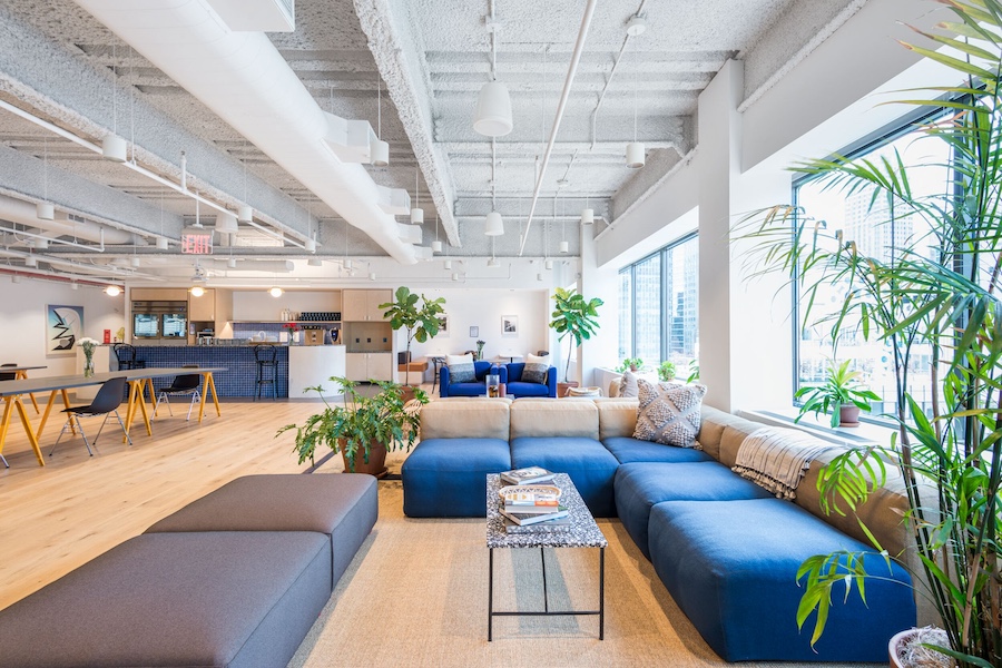 Flexible office interiors at WeWork 199 Water Street, Financial District, featuring shared workspaces, private offices, and modern meeting rooms.