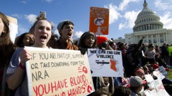 Gun control protesters with petitions 