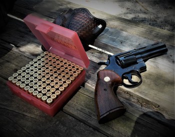 Colt Python revolver with box of handloaded ammunition