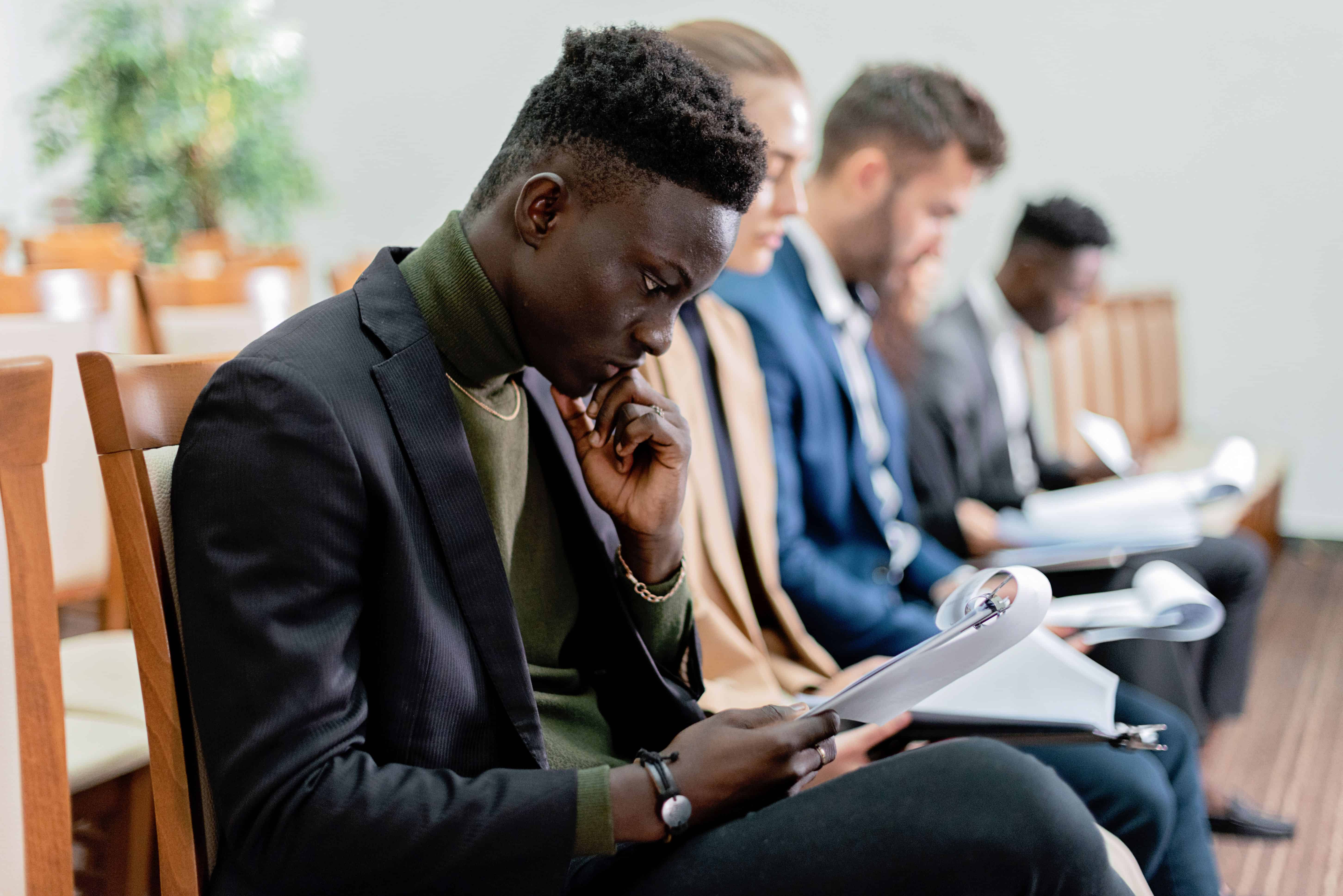 Business professionals reviewing documents during a strategy meeting
