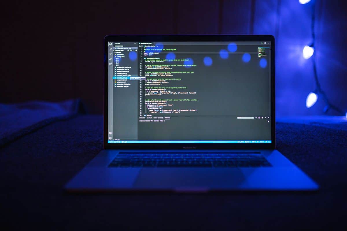 Laptop screen showing software code for breach review
