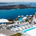 Luxury Santorini cliffside villa with pools overlooking the deep blue Aegean Sea and volcanic caldera bay - Where to stay in Santorini - Best Areas Guide