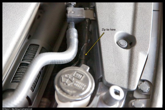 Zip tie #3: near windshield washer reservoir