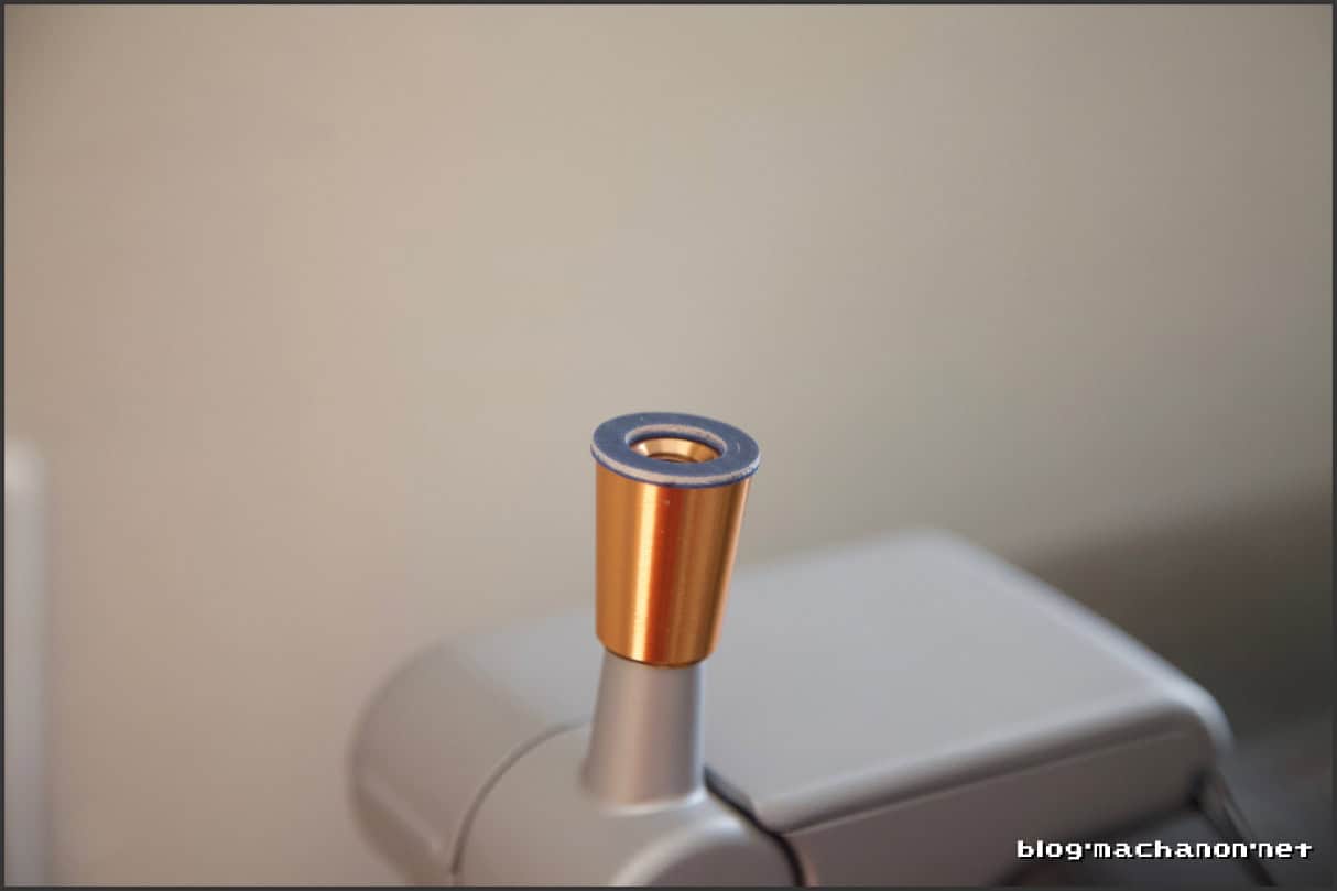 SAE 5/16" metal washer placed between the tap handle and the collar.