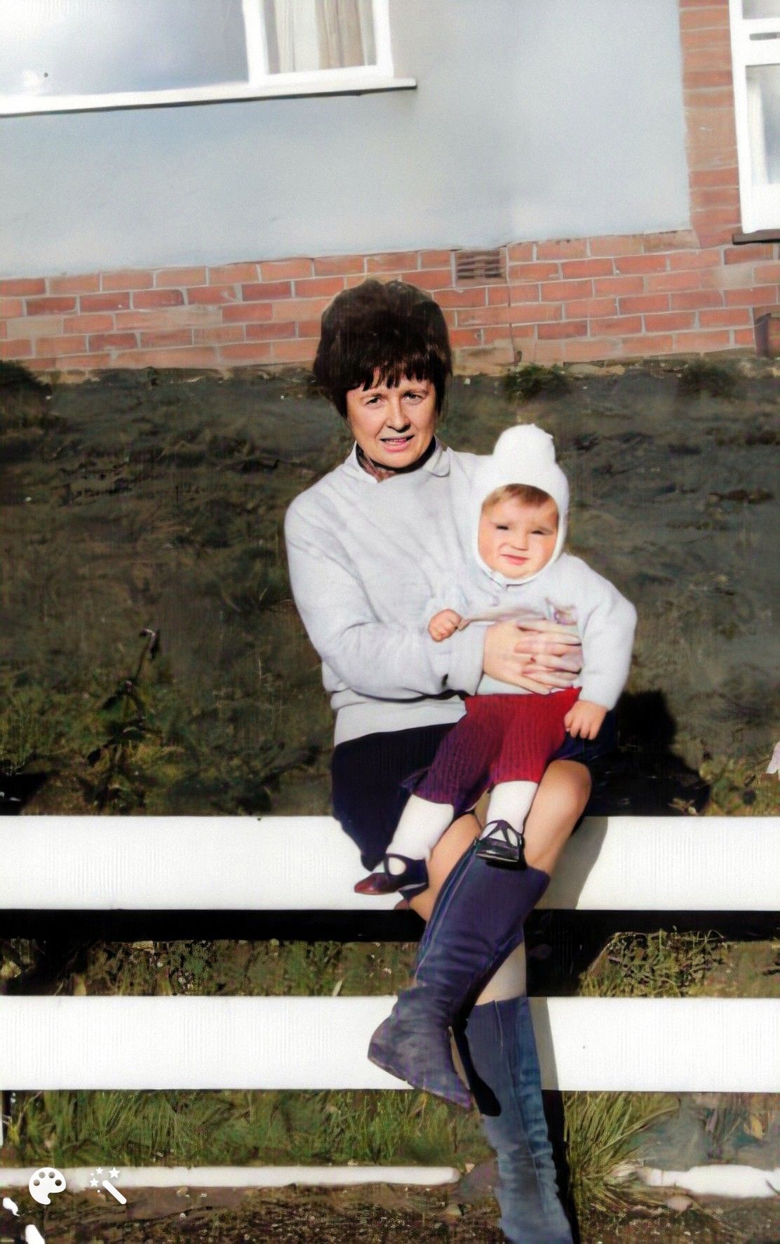 Chris as a baby with his adoptive mother. Photo enhanced and colorized by MyHeritage