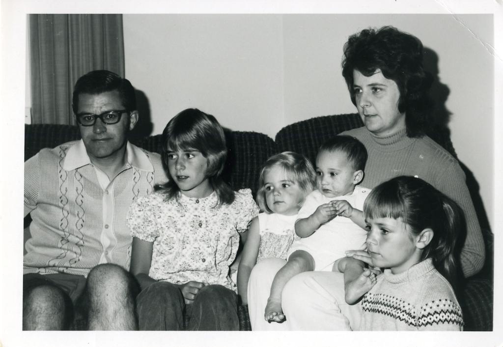 Kim settling in with his new adoptive family. Photo colorized and enhanced by MyHeritage