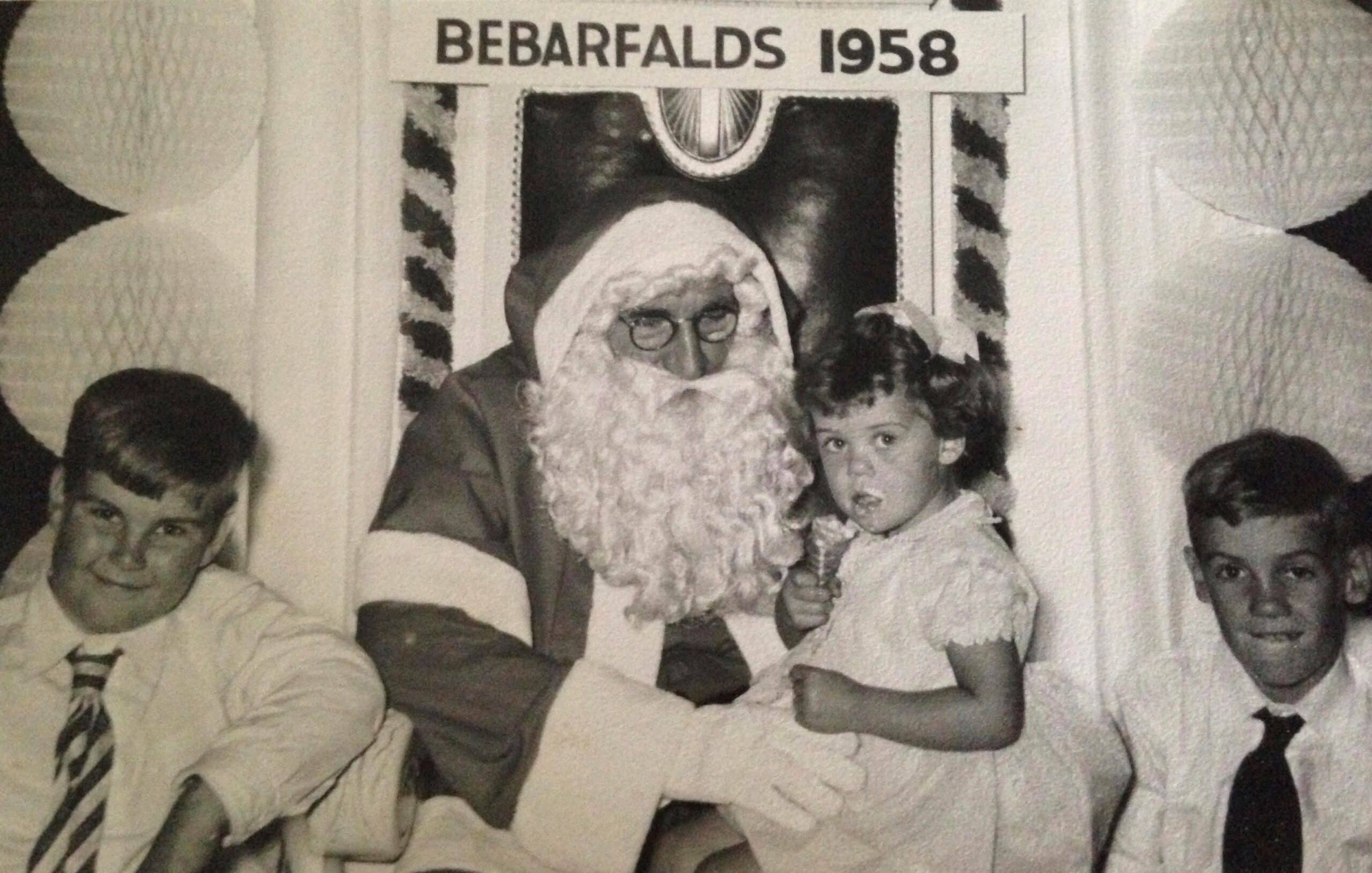 Sharyn and her siblings with Santa. Photo enhanced and colorized by MyHeritage