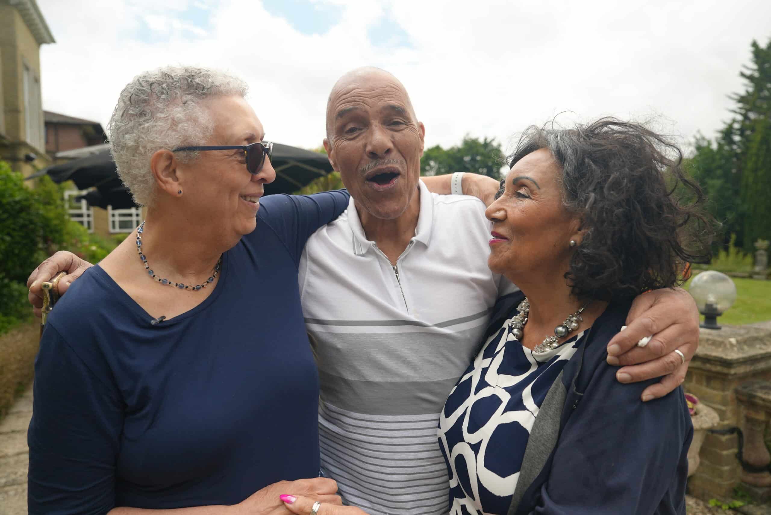 Left to right: Siblings Lorraine from Canada, and Jimmy and Josie from England meet for the first time.