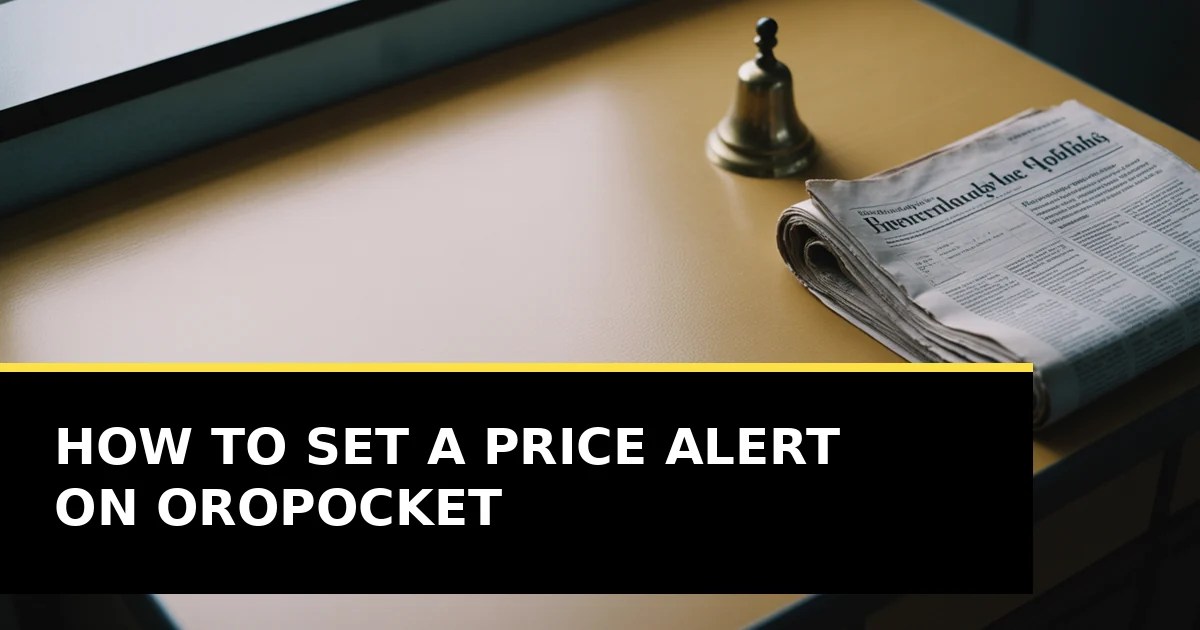 A small brass bell on a pale desk beside a folded newspaper, in soft daylight