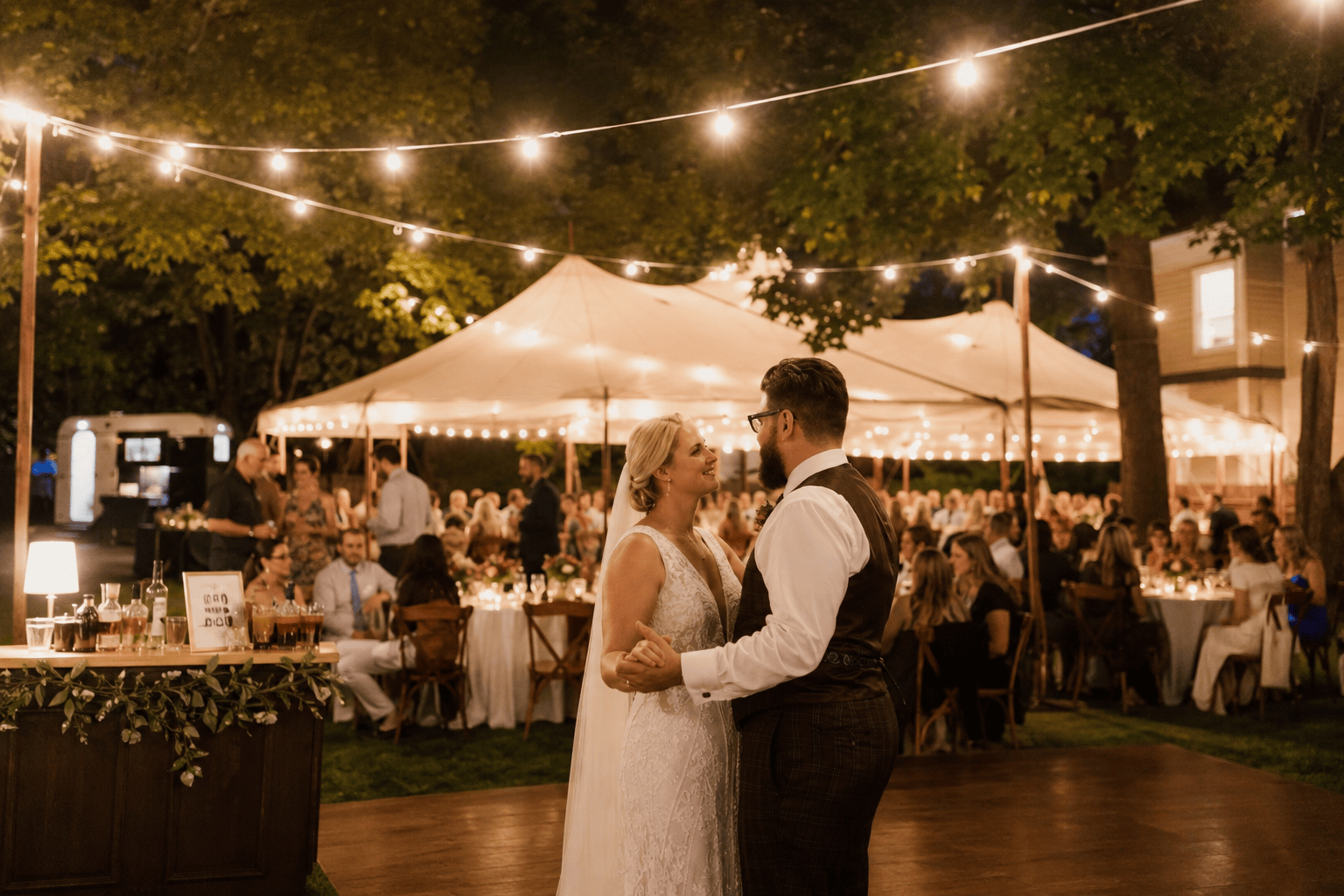 Philadelphia backyard wedding with a tent, string lights, bar and dance floor