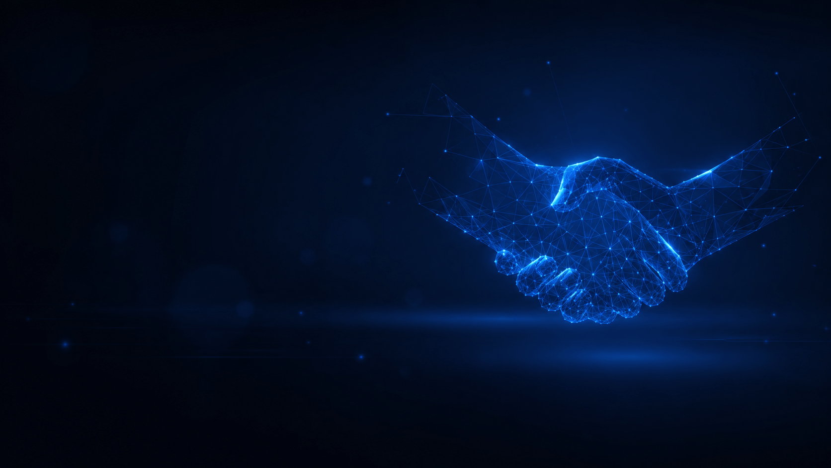 A stock image of a handshake formed by pixels