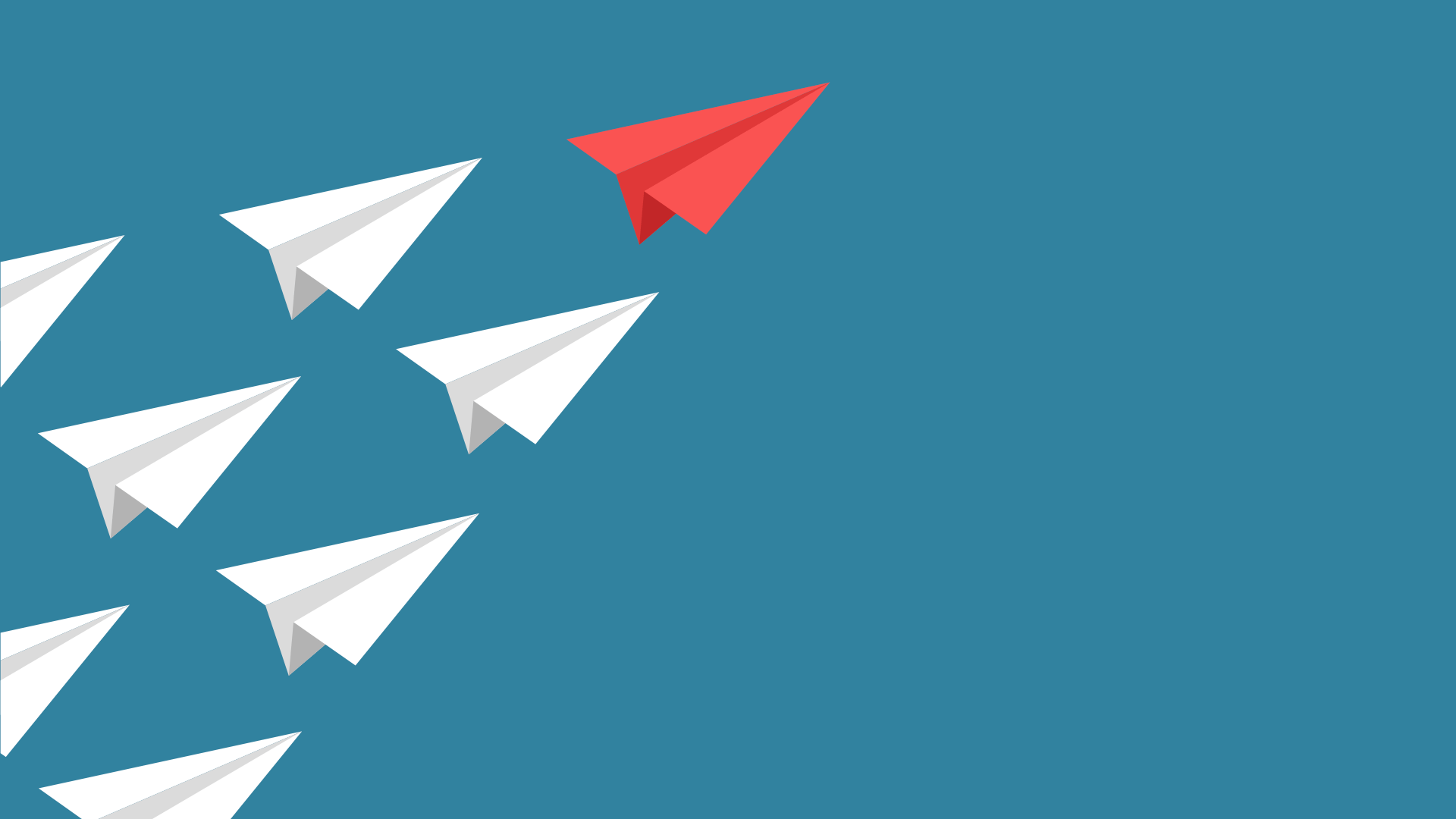 Paper planes with one red one in the lead