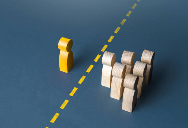 A Person And A Group Of People Are Separated By A Yellow Line