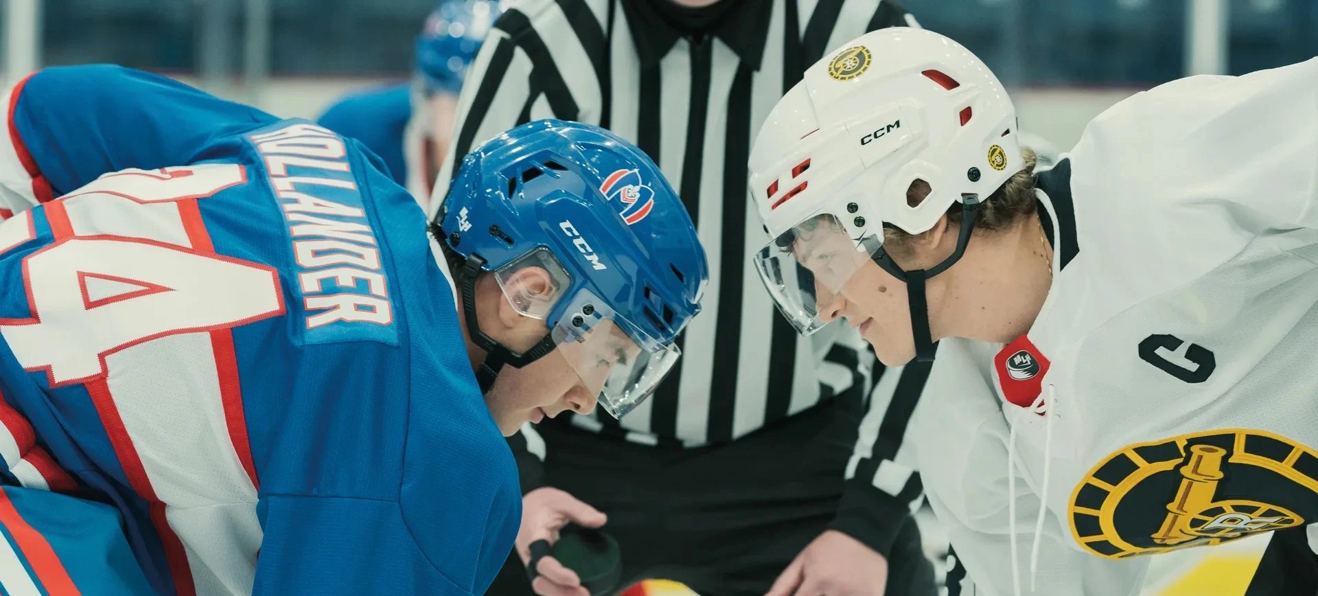 Intense hockey face-off between rivals Shane Hollander and Ilya Rozanov on the ice in the Heated Rivalry series.