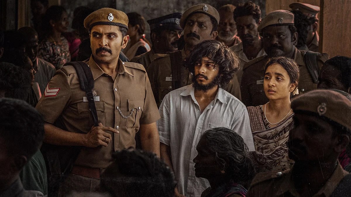 Mark 2025 movie courtroom drama scene with police officers surrounding accused characters during a tense investigation moment