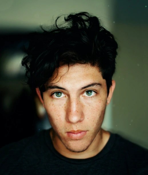 A medium-close-up shot of an actor with a soft background, illustrating a common 'MCU' framing.