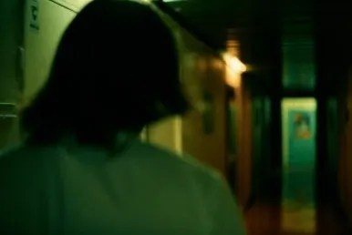 A dialogue scene with one character in the foreground and the other facing them.