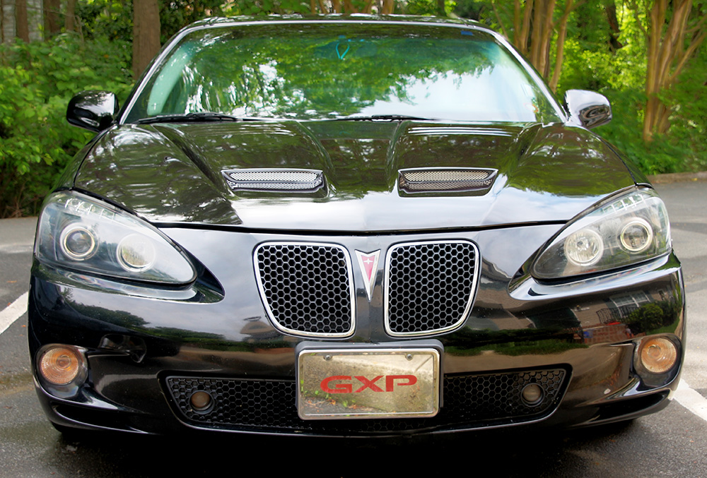 A 5.3 litre slice of freedom nestled in cosily, distributing 303hp and 323 lb/ft of torque between the set of 255mm potenzas up front, bringing the skinny 225 . Grand Prix GXP Inferno Ram Air Hood from PFYC - TJ Nevis Blog