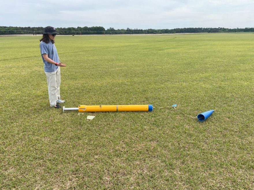Dottie McSpadden looks down at the crashed rocket before it exploded.